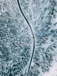Winter driving conditions in Austria, serene snowy landscape from an aerial view