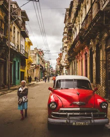 Colorful photo art featuring a red vintage car on the streets of Havana.