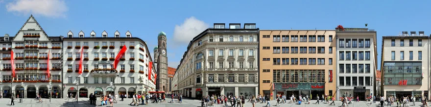 Photo art by Joerg Dietrich: lively street view of Munich featuring the Frauenkirche