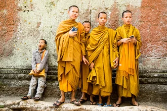 Fotografie eines Mönchs auf einer Reise durch Kambodscha mit orangener Mönchskutte.