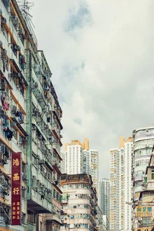 Colorful city view of Kowloon: high rises and clouds in the sky