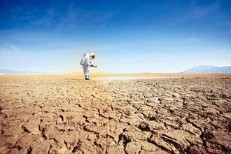 Photo of a protestonaut enjoying water in a dry environment.