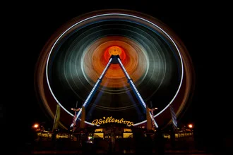 Photo art by Jochen Fischer: long exposure of a Ferris wheel at night