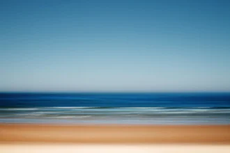 Photo art by Manuela Deigert: calm summer beach with gentle waves and clear sky