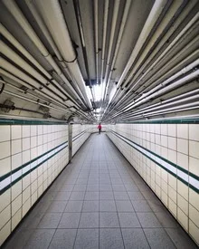 Photo art by Roc Isern: view into an underground tunnel with mysterious lighting.