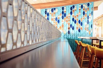 Charming photo of a diner restaurant along the Pacific Coast with a blue facade.