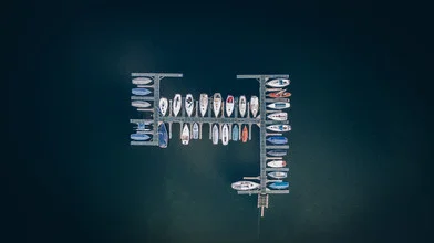 Aerial view of a lake with boats, peaceful mood and soft colors