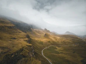 Beautiful photo art of Scottish mountains in fog, soft colors, and a calming atmosphere.