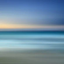 Abstract photo art featuring gentle waves breaking on the shore in calm colors.