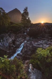 Waterfall in Glencoe: gentle flow surrounded by Scottish Highlands