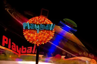 Photo art by Jochen Fischer: long exposure of a fairground with colorful lights