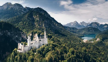 Photo art by Rémi Peschet: aerial view of a fairy tale castle in Bavaria