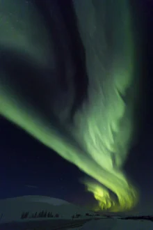 Photo art by Dirk Heckmann: Northern lights over a Nordic landscape
