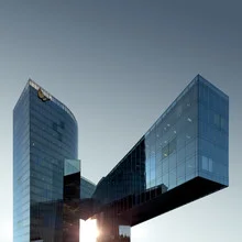 Photo art by Pau Iglesias: modern skyline featuring a glass skyscraper in Barcelona.