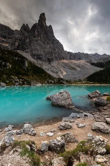 Photo art by Mikolaj Gospodarek: serene view of Lago di Sorapiss and the Dolomites.