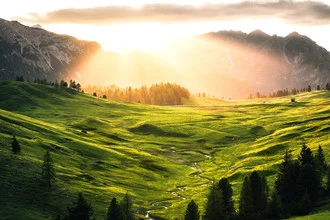Photo art by Martin Morgenweck: softly lit valley with mountains in the background