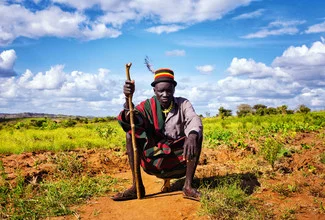 Photo art by Victoria Knobloch: serene scene from Karamoja, Uganda, featuring Karamojong people