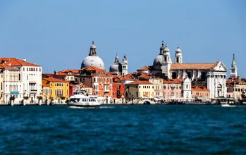 Photo art by Rémi Peschet: serene lagoon scene with gondolas in Venice