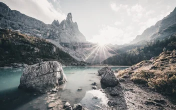 Photo art by Franz Sussbauer: serene Sorapis lake backlit by the sun.
