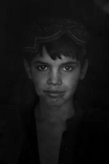 Photo art by Rada Akbar: refugee camp in Kabul showing people and tent structures.