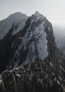 Photo art by Christoph Johann: snow-covered mountains under a soft sunset