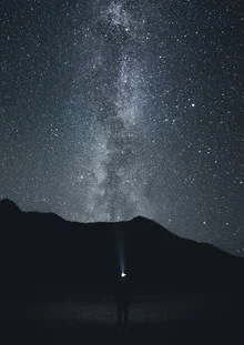 Photographic depiction of a night mountain landscape featuring the Milky Way.