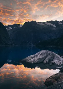 Photo art by Niels Oberson: Burning clouds over Lake Gelmer in the Alps.