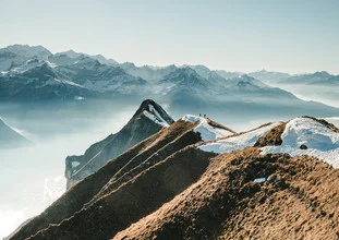 Photo art: Hiking on the ridge in the Swiss Alps with snow and sea of fog.