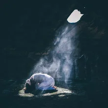 Dark scene with a beam of light bringing hope into the darkness