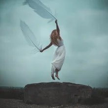 Photo art by Rova Fineart - Simone Betz: woman levitating with feathers in a dress.