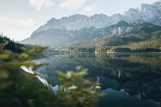 Photo art by Fabian Schumann: serene mountain landscape reflecting in Eibsee