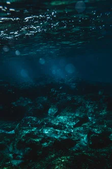 Underwater photo showcasing gentle waves and a calm mood in the ocean