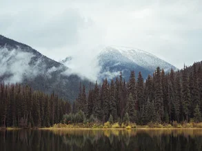 Photo art by Manuel Gros: calm lake reflecting mountains and clouds