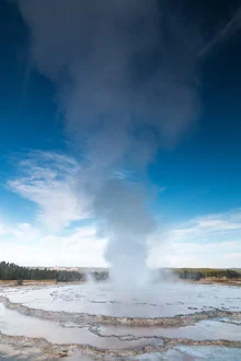 Photo art by Christoph Schaarschmidt: Geyser under blue sky in Yellowstone National Park
