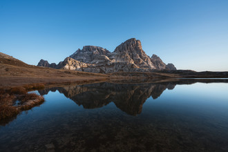 Simon Migaj, Mountains reflected in a lake at Tre Cime di Lavaredo - Italy, Europe)