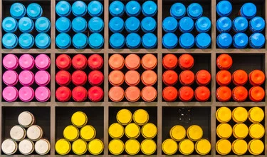Colorful shop with shelves full of spray cans in various shades