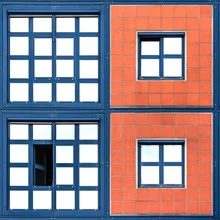 Colorful squares in blue and orange on a facade, geometric composition