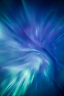 Photo art by Sebastian Worm: Northern lights over a starry night in Norway