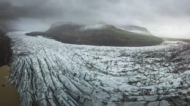 Photo art by Roman Huber: glacier tongue in Iceland with clouds and ice