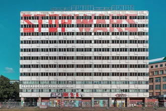 Photo art by Michael Belhadi: graffiti on the Haus der Statistik in Berlin.