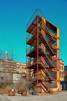 Photo art by Michael Belhadi: Container in soft colors against an urban backdrop.