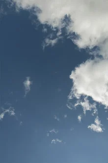 Bright sky with clouds, a calm scene conveying freedom and adventure.
