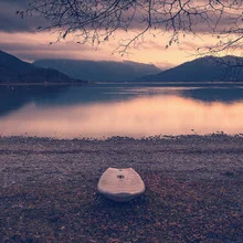 Photo art featuring a surfboard at Lake Tegernsee during sunset