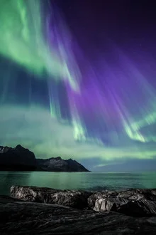 Photo art by Sebastian Worm: Aurora Borealis over Norwegian coastal landscape
