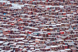Photo art by Li Ye: Red house in the snowy landscape of Sertar
