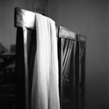 Close-up of a dupatta on a chair, gentle colors and calm atmosphere.