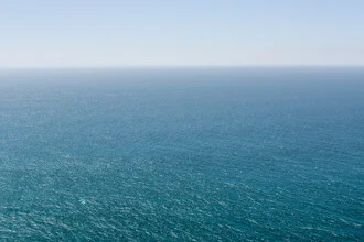 Photo of the Pacific, gentle waves under a clear sky