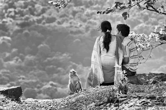 Photo art by Rob van Kessel: couple with monkey enjoying coffee in nature