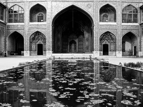 Reflection of the mosque in Shiraz, gentle black-and-white composition.