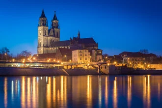 Photo of Magdeburg Cathedral at dusk, soft colors in the sky.
